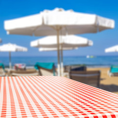 Desk of free space and beach background 