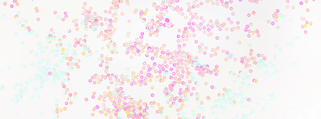 Pearl pastel confetti sparkles on white background