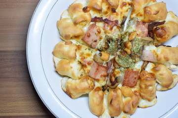 Cheese Meat Italian Pizza On Plate With Wooden Table In The Background