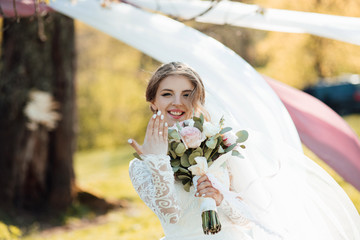 Happy cheerful bride shows hand with ring. Positive glad fiancee looking impressed, rapturous,...