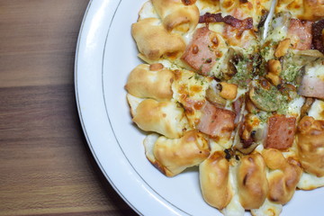 Cheese Meat Italian Pizza On Plate With Wooden Table In The Background