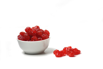 a bowl of dried cherry isolated on white background