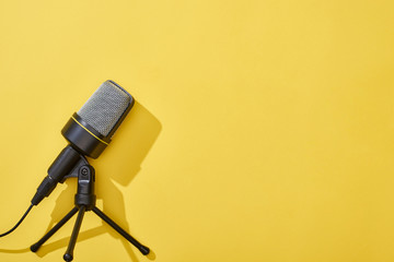top view of microphone on bright and colorful background