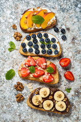 Sweet toast assortment with fresh fruit and berries.