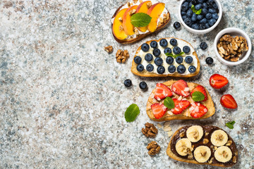 Fototapeta na wymiar Sweet toast assortment with fresh fruit and berries.