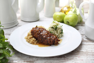 Vegetarian cuisine. An appetizing vegetable chop dish served with groats and salad.