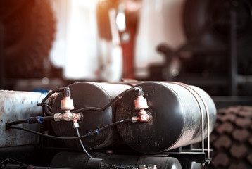 Two iron gas automobile cylinders