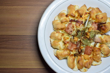 Cheese Meat Italian Pizza On Plate With Wooden Table In The Background