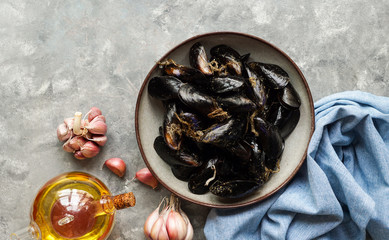 Fresh mussel, sea food,  with garlic ready to be cooked, top view, copy space      