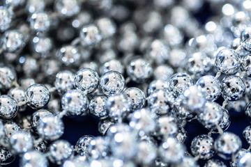 close up of silver beads. christmas and holiday decoration concept