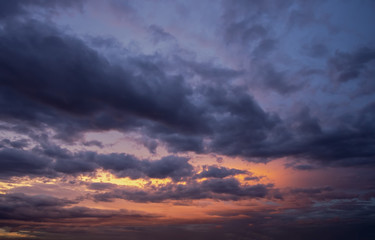 Naklejka na ściany i meble Sunset with dramatic sky and colorful clouds.
