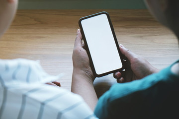 Friends watching social media in a smart phone. social network concept with smart phone. white screen for mockup.