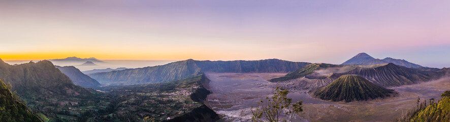 Fototapeta na wymiar Sunrise at the Bromo Tengger Semeru National Park on the Java Island, Indonesia. View on the Bromo or Gunung Bromo on Indonesian, Semeru and other volcanoes located inside of the Sea of Sand within