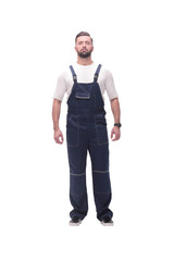 confident young man in blue overalls . isolated on white