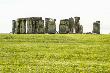 Stonehenge. Prehistoric stone monument near Salisbury, Wiltshire, UK. Green grass in the...