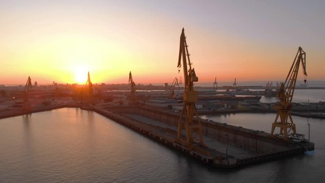 aerial view of a shipyard at sunset