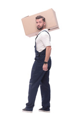 rear view. a young man with a cardboard box looking at the camera