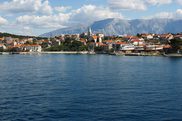 Panoramic view of picturesque village Sumartin on Brac island, Croatia. Shot from the ferry leaving from Sumartin to Makarska.