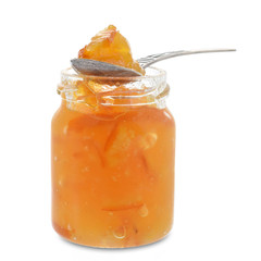 Orange jam in glass jar closed up isolated on white