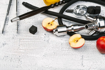 Parts of hookah and fruits on wooden background