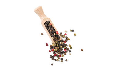 colored pepper peppercorns in wooden scoop isolated on white background. top view. spices and food ingredients.