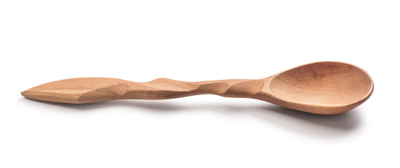 Carved wooden spoon on isolated white background