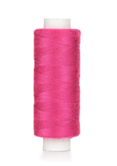 Pink spool of thread isolated on white background. Closeup