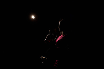 Professional musician recording new song in studio.