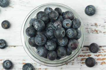 A glass bowl with blueberry