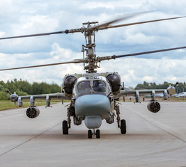 Fototapeta na wymiar Military combat helicopter taxis on the steering track.