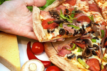 Pizza with sausages pepperoni with ham, mushrooms and cheese