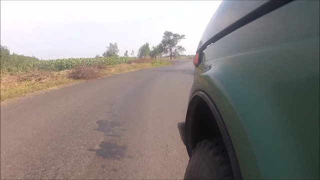 Shot with a camera attached to the front of an off road vehicle driving along a small road,Lada,Lada Niva,off road,road, Hungary