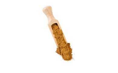 ground or milled cinnamon in wooden scoop isolated on white background. top view. spices and food ingredients.
