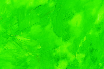 Bright abstract texture oil paint on canvas, light green color with a background of strokes.