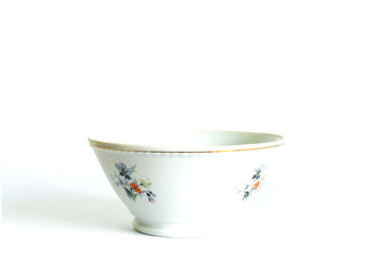 white old soup plate with enameled designs