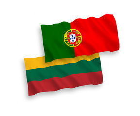 National vector fabric wave flags of Lithuania and Portugal isolated on white background. 1 to 2 proportion.