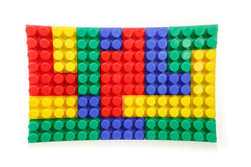 Children's colorful plastic construction toy bricks on white