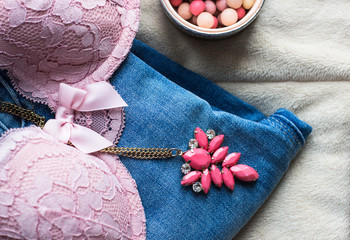 Womens sexual pink lingerie, jeans, jewellery, blush meteorites on white background flat lay, copy...