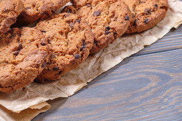 Chocolate oatmeal chip cookies on the rustic wooden table.
