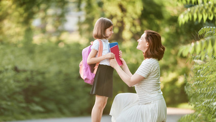 Parent and pupil go to school