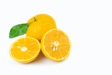 Orange fruits with leaf on isolated white background.