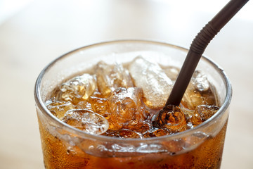 Close up top view of cola in a glass.