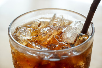 Close up top view of cola in a glass.