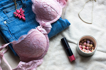 Womens sexual pink lingerie, jeans, jewellery, blush meteorites on white background flat lay, copy...
