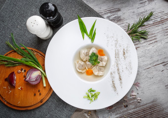Exquisite composition with dumplings, carrots and onions
