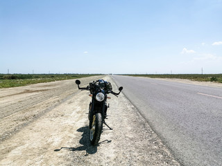 Obraz premium Moto travel on retro cafe racer motorcycle