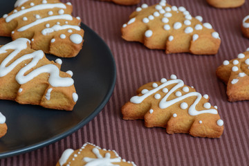 New Year's party ideas for kids. Christmas snack, cookies in shape of trees. Christmas homemade ginger cookies