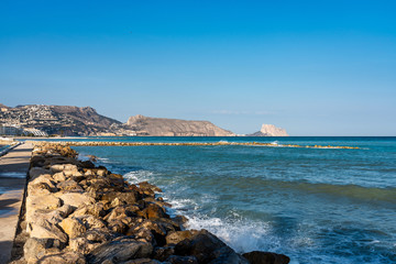 Fototapeta na wymiar The beautiful rocky beach of Altea, a small town in Alicante, Spain