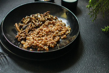 buckwheat porridge with mushrooms. food background. top view. copy space