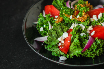 Healthy salad, tomato, lettuce leaf salad (mix micro greens, juicy snack) leaves mix. food background